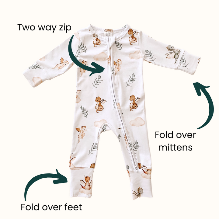 Mystique dragon print organic cotton onesie highlighting two-way zip, fold-over mittens, and fold-over feet for added convenience and comfort.