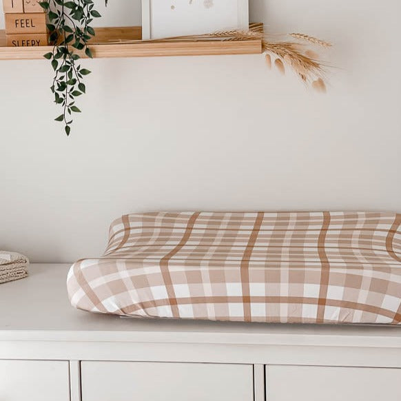 Change table with a change mat covered in a 100% cotton brown plaid change mat cover 