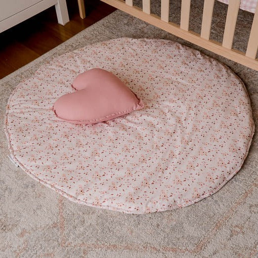 A top view of the underside of the Peachy Pink Gingham Playmat in a Modern Newborn Baby Nursery.