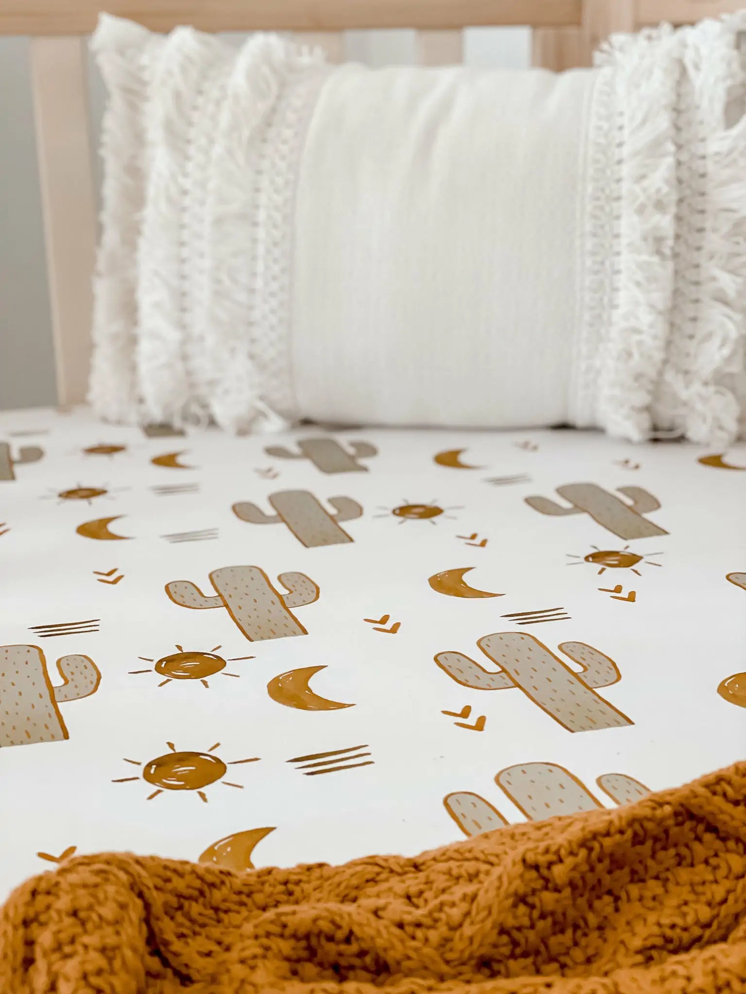 Great simple pattern to fit in any designer nursery, Brown cactus, suns on a white background.