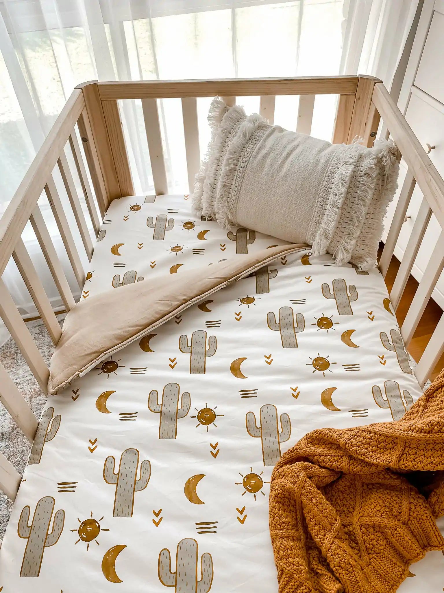 Green Cactuses, brown moons with a soft brown backing, makes for the perfect gender neutral nursery.
