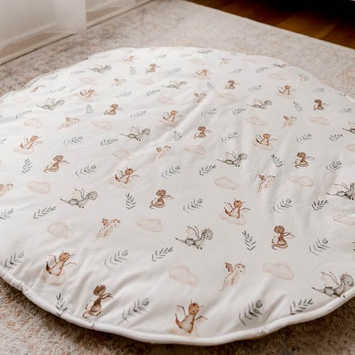 Cotton Playmat with a dragons, leaves and clouds in a seemless pattern set out on a floor rug