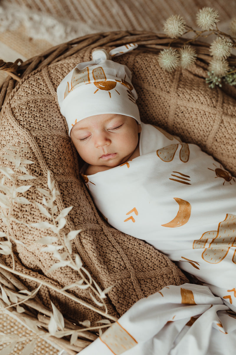 Snuggly Jacks Canada Arizona Jersey Swaddle: Brown Moons, Suns, and Green Cactuses Print