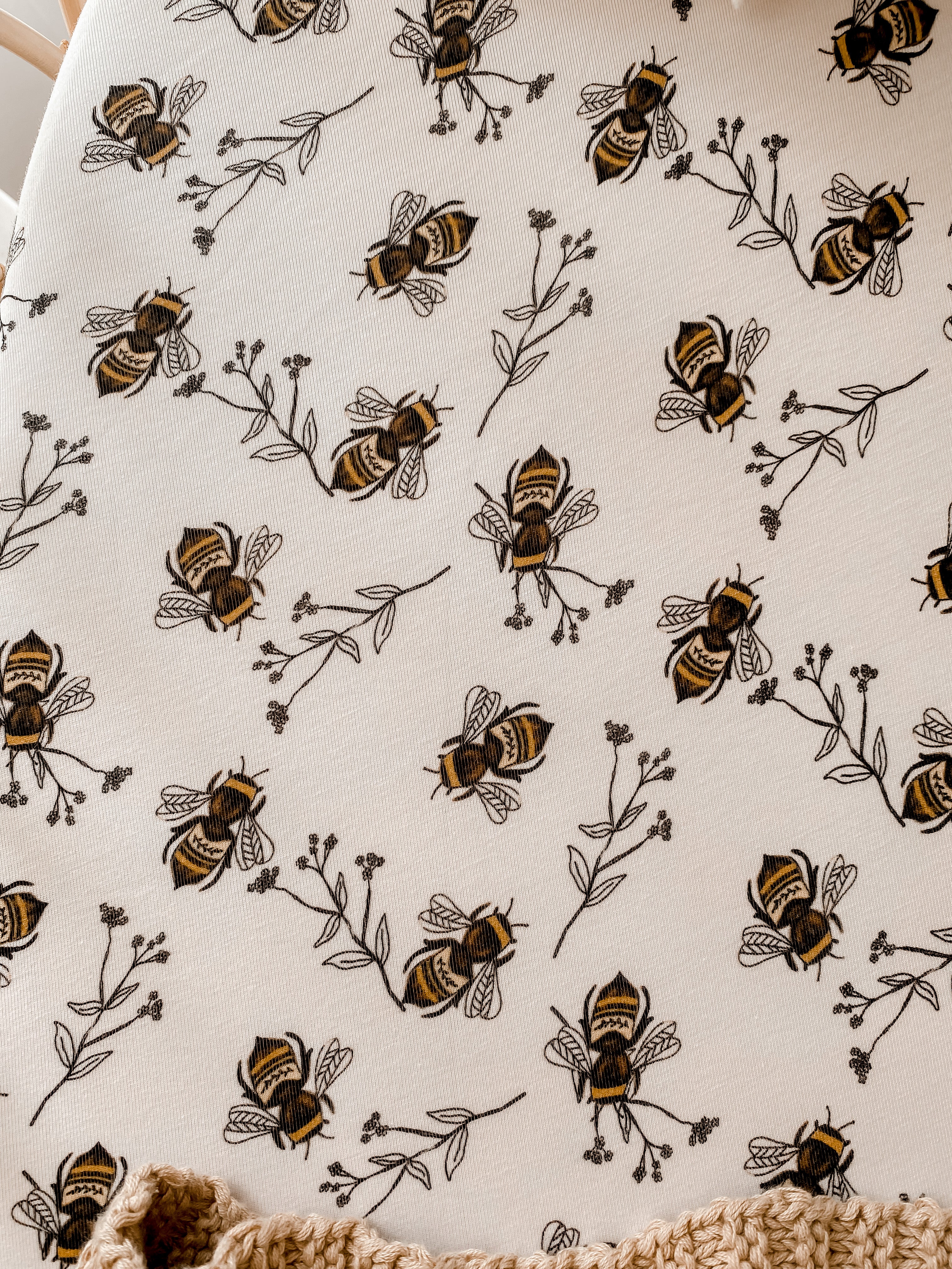 Snuggly Jack's exclusive bee print in a bassinet sheet/change pad