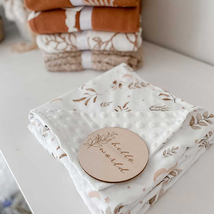 Baby Change table with a Twilight Minky Blanket on the top and a Snuggly Jacks Announcement disk on top.