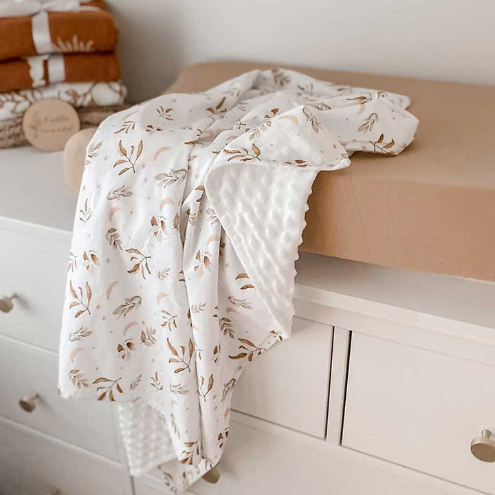 Baby Change Table with a Snuggly Jacks Camel change mat cover and Twilight Minky Blanket Draped over the change mat