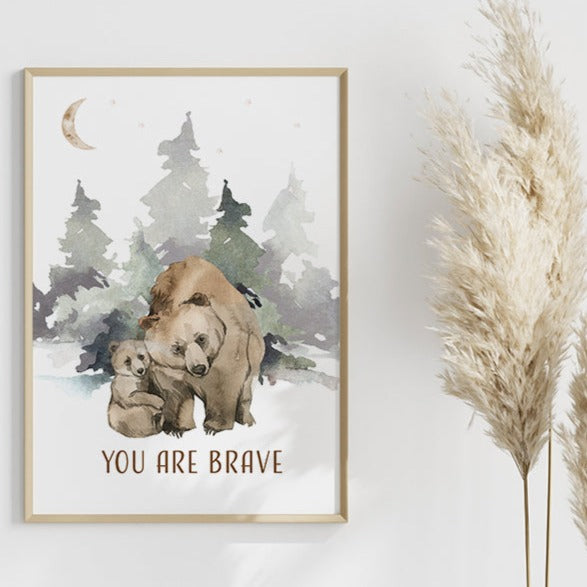 Wooden frame of a picture of a bear and her cub in the woods hanging on a wall